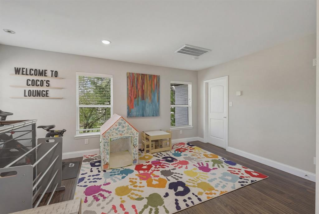 5914 Goodwin Avenue Dallas, TX 75206 - Photo 22 of 32 a bedroom with furniture and a window