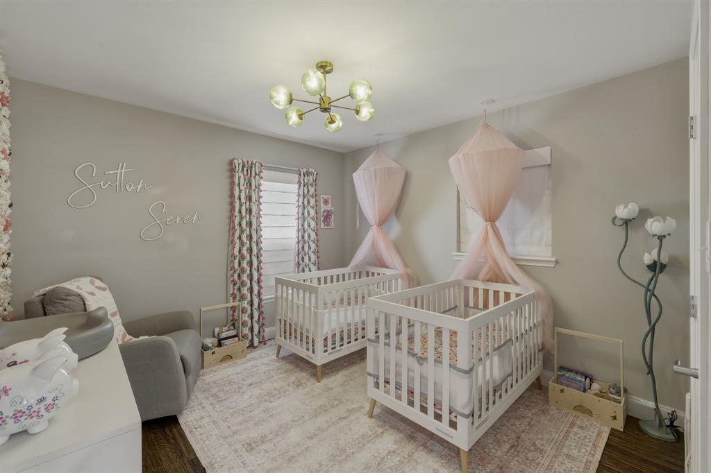 5914 Goodwin Avenue Dallas, TX 75206 - Photo 23 of 32 a view of a bedroom with furniture