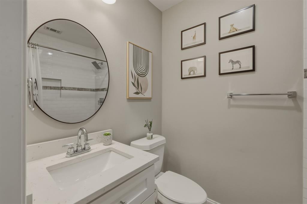 5914 Goodwin Avenue Dallas, TX 75206 - Photo 25 of 32 a bathroom with a sink mirror and toilet
