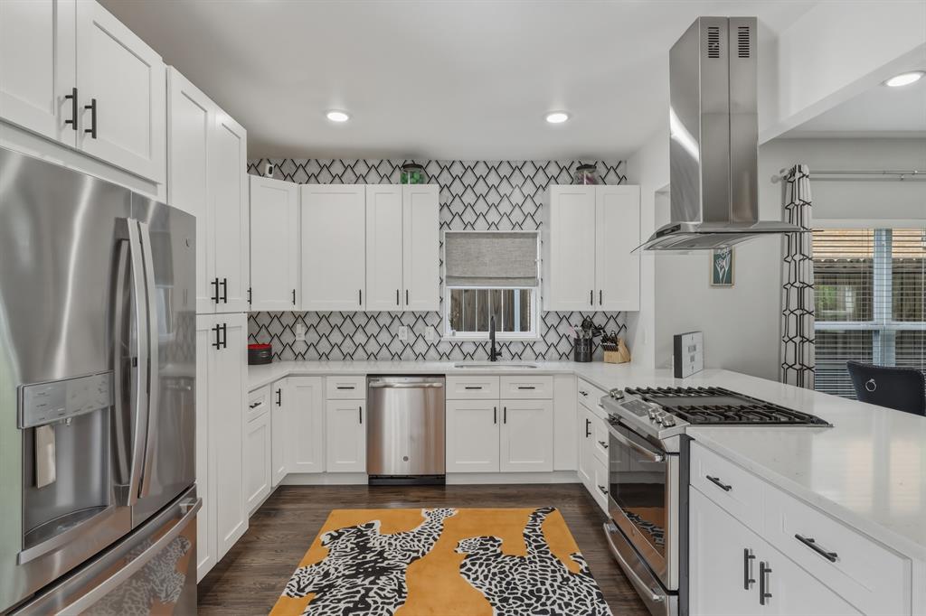 5914 Goodwin Avenue Dallas, TX 75206 - Photo 9 of 32 a kitchen with a sink stove and refrigerator