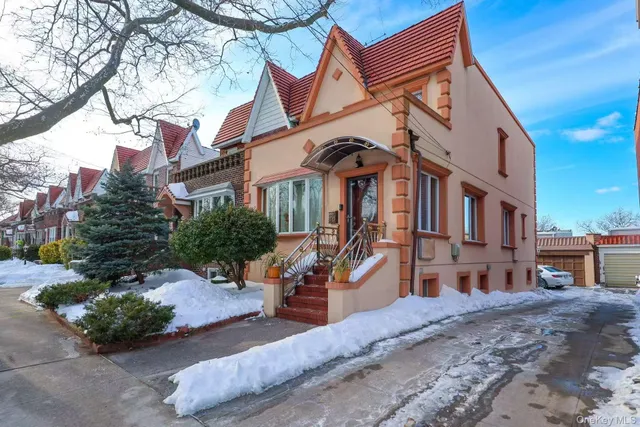 a front view of a building with a yard