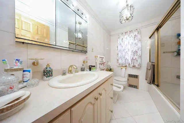 a bathroom with a sink a mirror and a shower