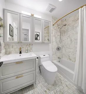 a bathroom with a sink a toilet and a bathtub