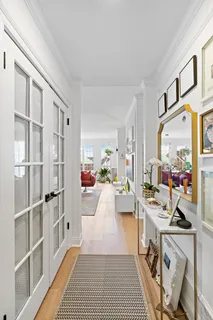 a view of living room filled with furniture and a rug
