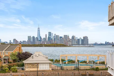 a view of a city with an ocean view
