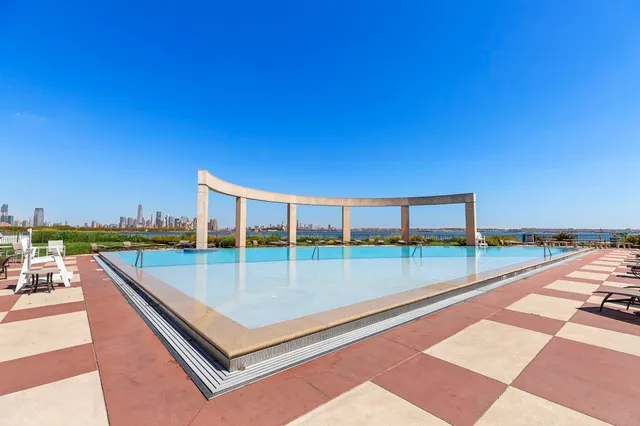 a view of a balcony with floor to ceiling windows with wooden floor