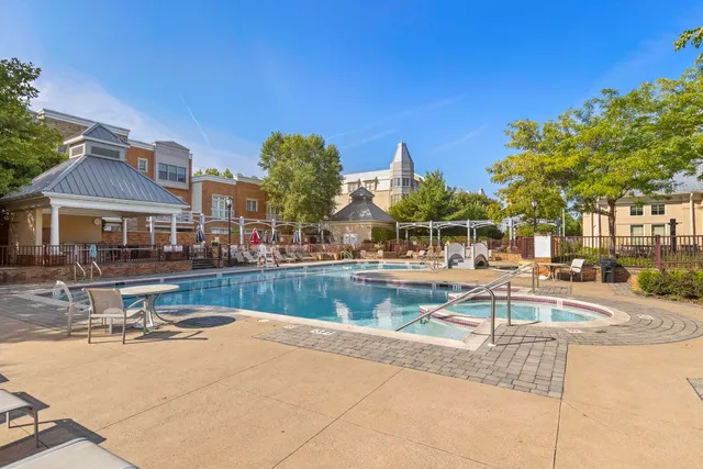 a view of a swimming pool with a lounge chairs