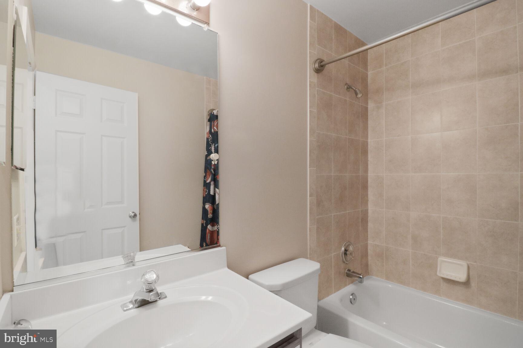 1924 North Daniel Street Arlington, VA 22201 - Photo 11 of 23 a bathroom with a sink a toilet and shower