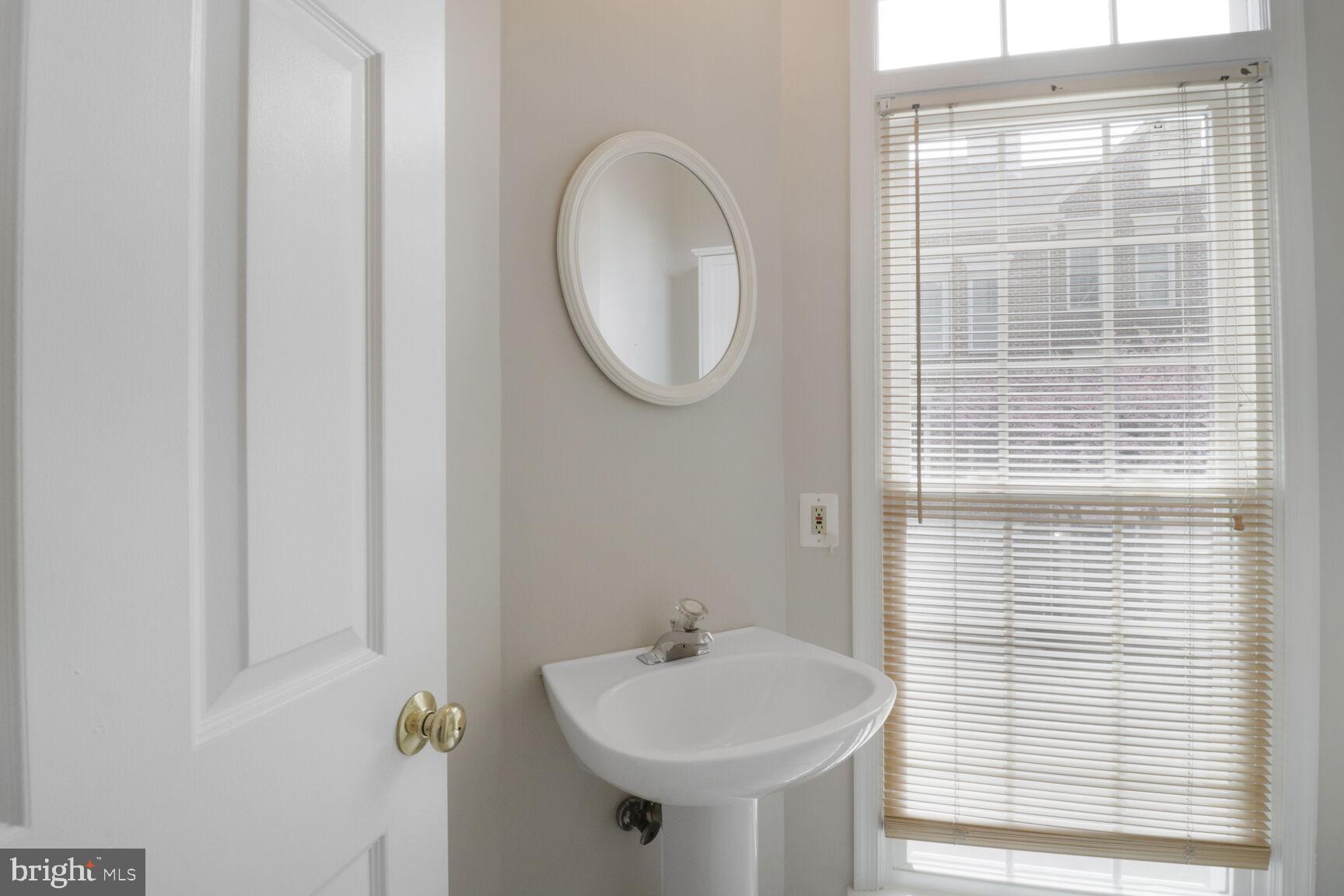 1924 North Daniel Street Arlington, VA 22201 - Photo 12 of 23 a bathroom with a sink and a mirror
