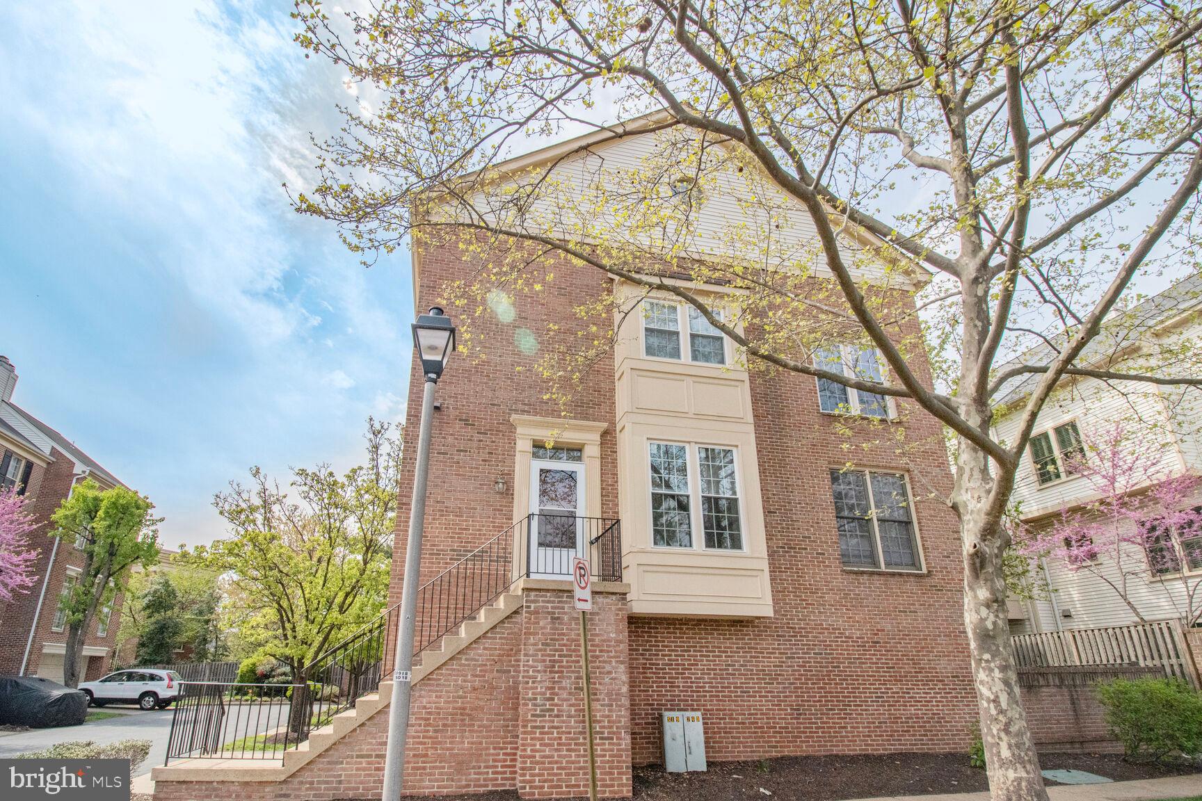 1924 North Daniel Street Arlington, VA 22201 - Photo 15 of 23 a yellow house with trees in front of it
