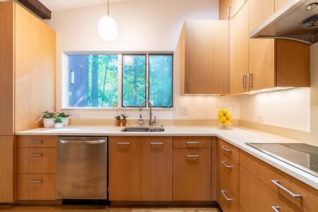 28 Peacock Farm Road Lexington, MA 02421 - Photo 15 of 29 a kitchen with a sink a window and cabinets