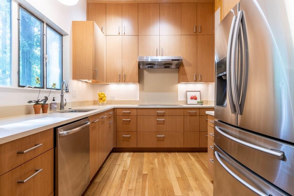 28 Peacock Farm Road Lexington, MA 02421 - Photo 16 of 29 a kitchen with a sink appliances and cabinets
