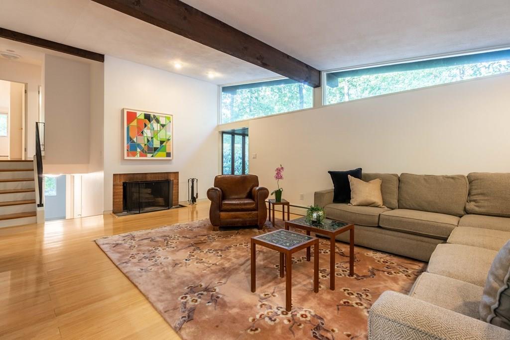 28 Peacock Farm Road Lexington, MA 02421 - Photo 6 of 29 a living room with furniture and a fireplace