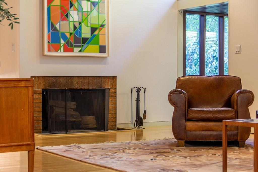 28 Peacock Farm Road Lexington, MA 02421 - Photo 9 of 29 a living room with furniture and a fireplace