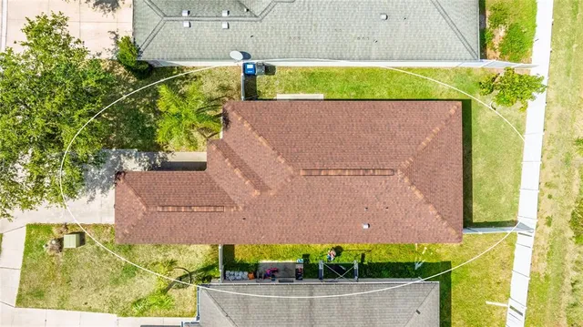 a view of house with a yard and a large pool