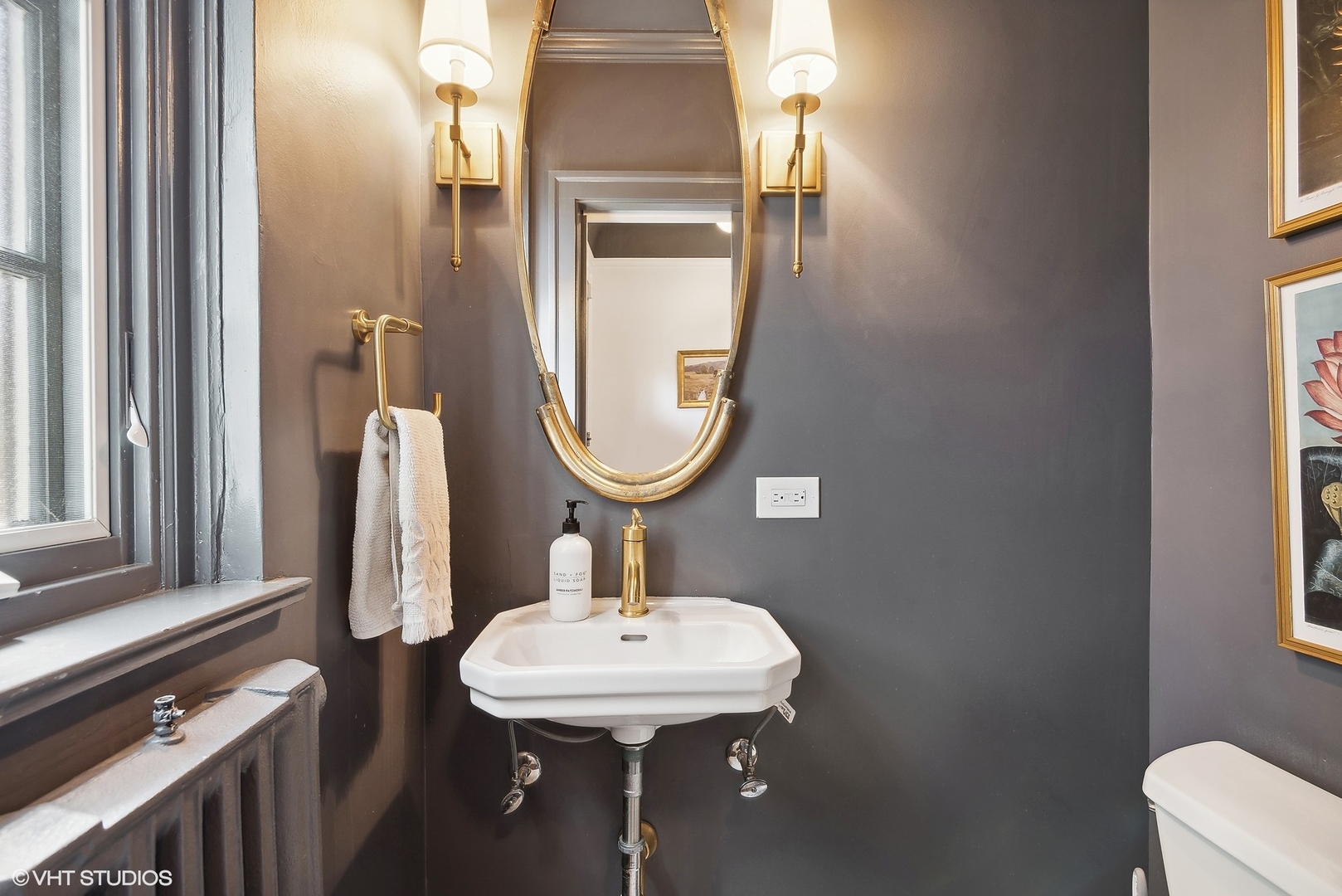 1701 Forest Avenue Wilmette, IL 60091 - Photo 15 of 35 a bathroom with a sink and a mirror