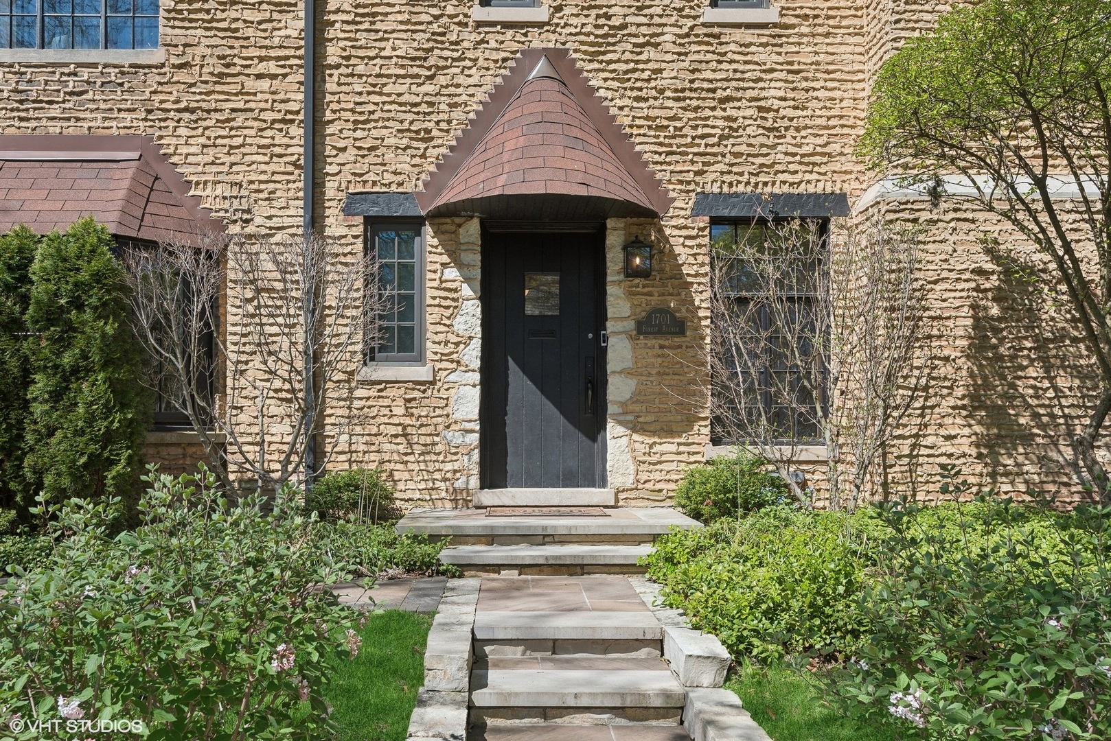 1701 Forest Avenue Wilmette, IL 60091 - Photo 2 of 35 a front view of a house with plants