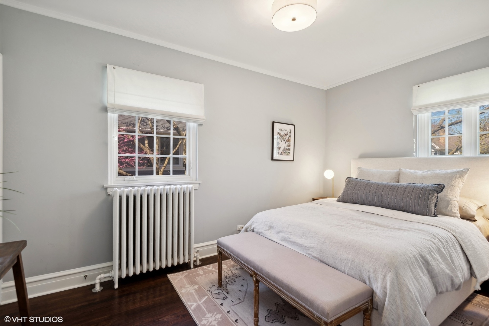 1701 Forest Avenue Wilmette, IL 60091 - Photo 23 of 35 a bedroom with a bed and wooden floor