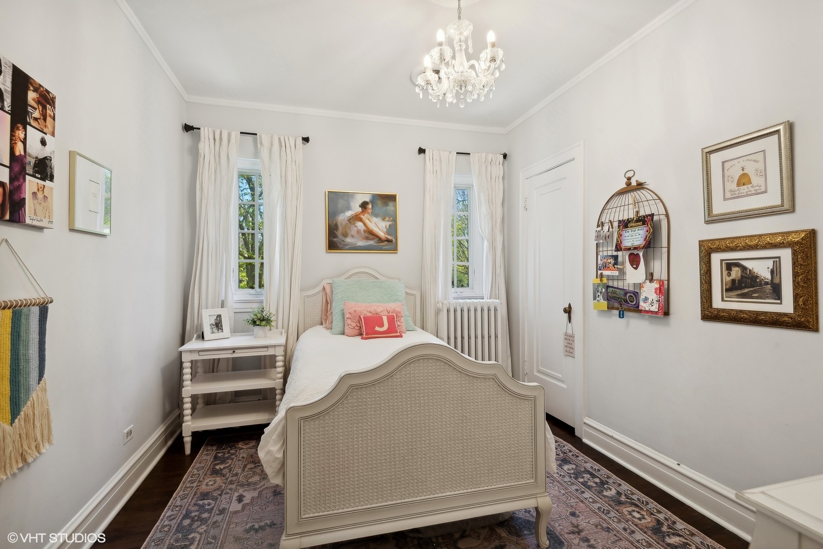 1701 Forest Avenue Wilmette, IL 60091 - Photo 24 of 35 a bedroom with a bed and a chandelier