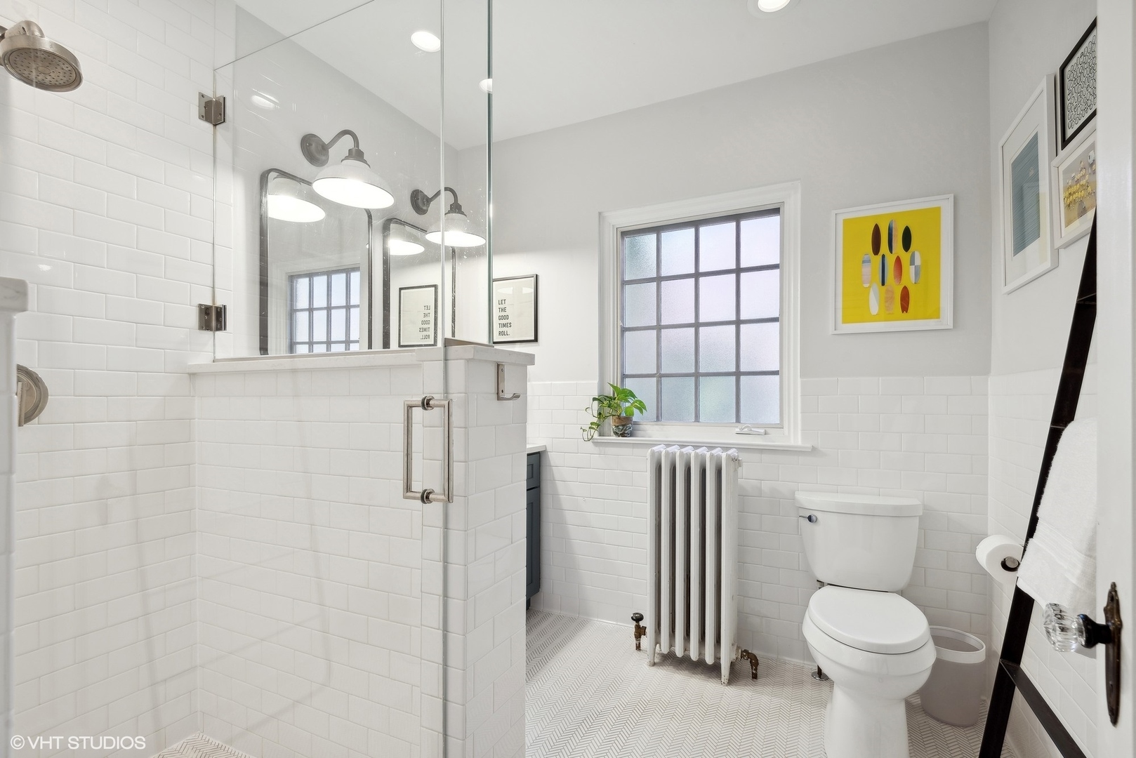 1701 Forest Avenue Wilmette, IL 60091 - Photo 25 of 35 a bathroom with a sink a toilet a shower and a window