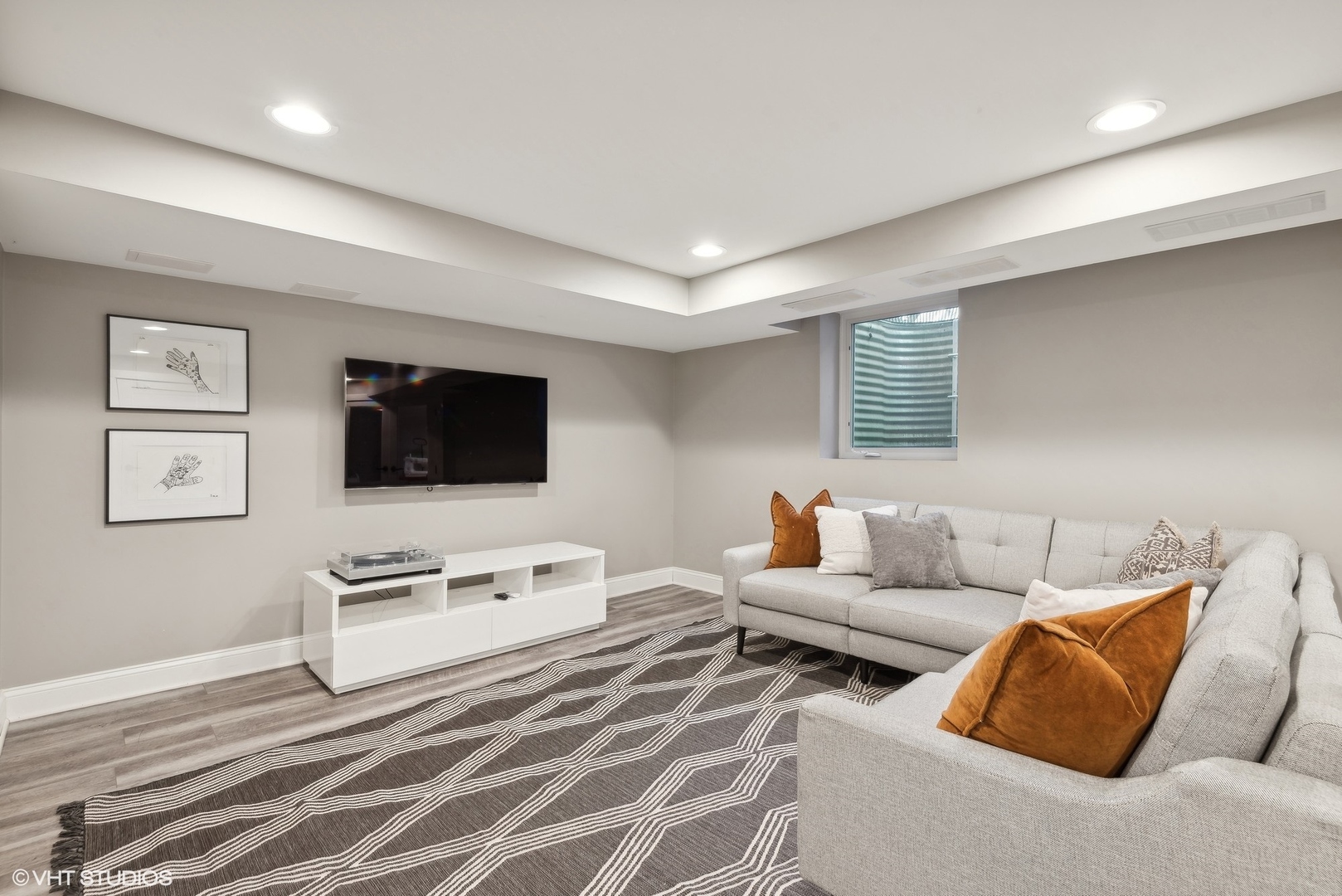 1701 Forest Avenue Wilmette, IL 60091 - Photo 26 of 35 a living room with furniture and a flat screen tv