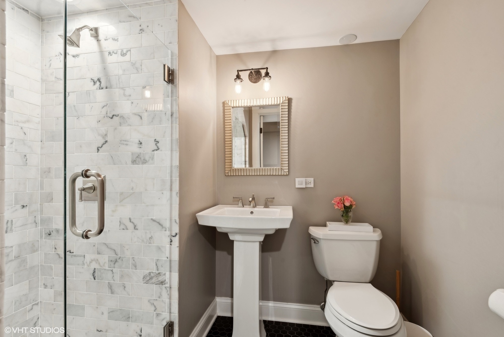 1701 Forest Avenue Wilmette, IL 60091 - Photo 28 of 35 a bathroom with a sink toilet and shower