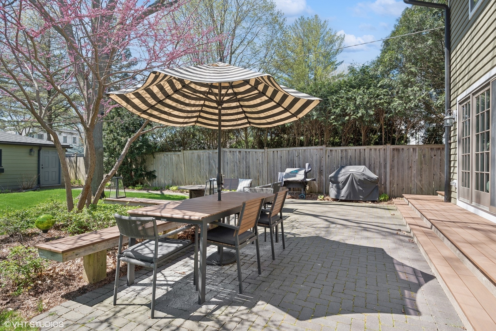 1701 Forest Avenue Wilmette, IL 60091 - Photo 29 of 35 a view of a backyard with table and chairs