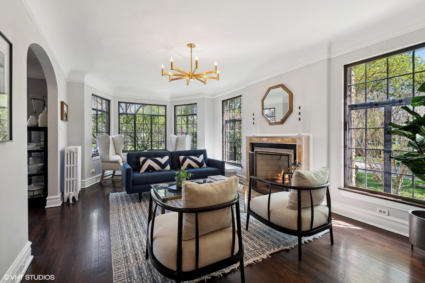 1701 Forest Avenue Wilmette, IL 60091 - Photo 4 of 35 a dining room with furniture a fireplace and wooden floor
