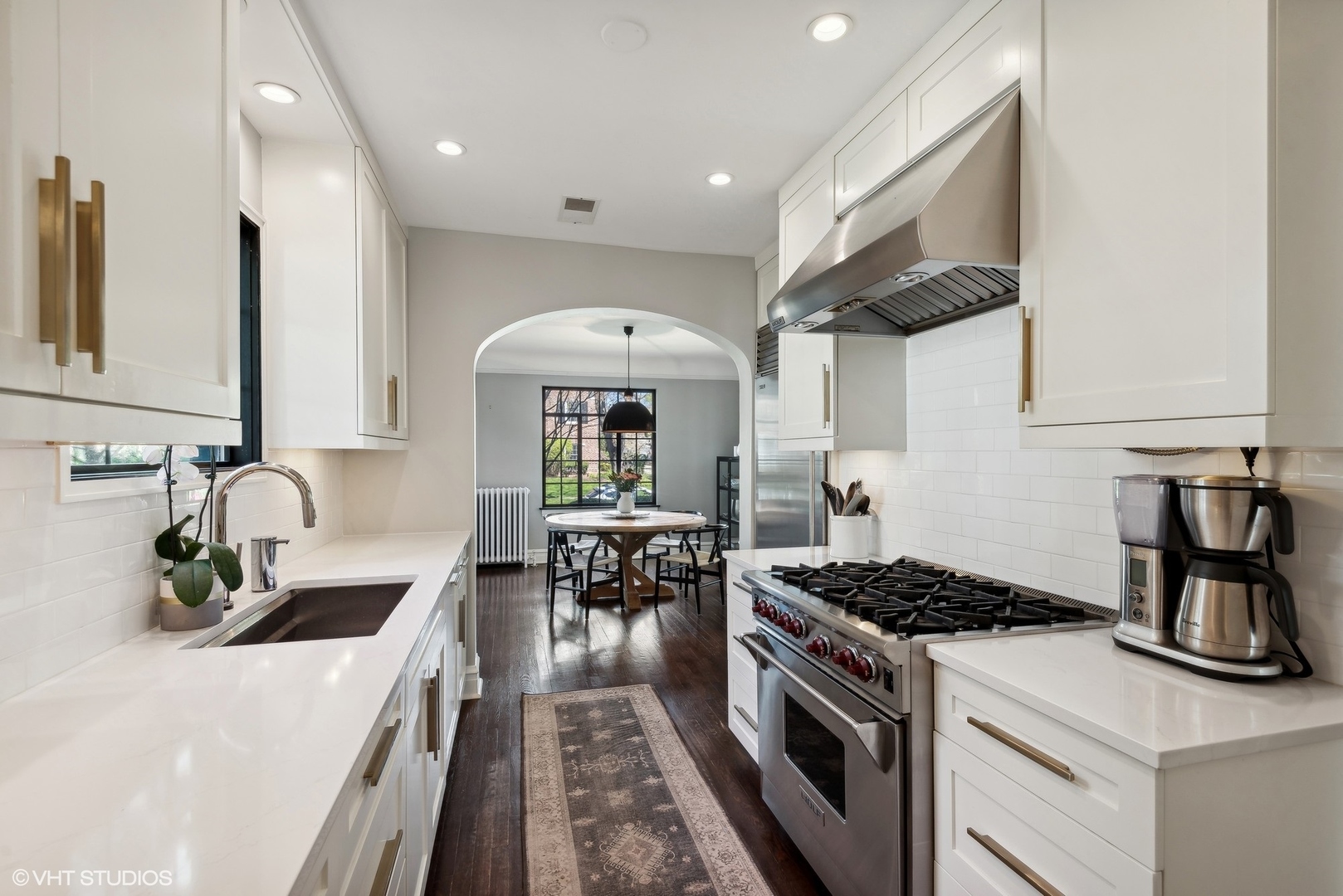 1701 Forest Avenue Wilmette, IL 60091 - Photo 8 of 35 a kitchen with a stove and a sink