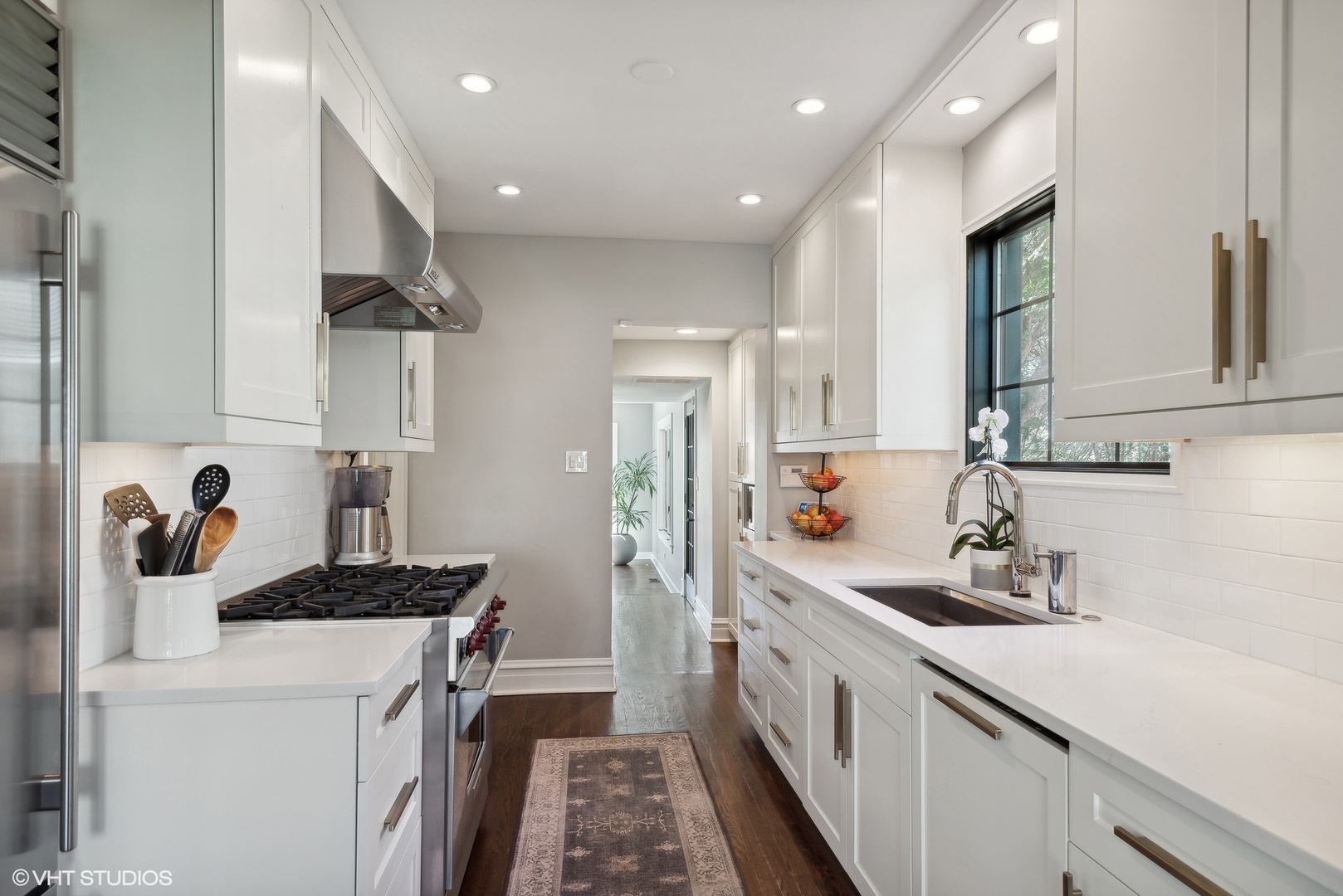 1701 Forest Avenue Wilmette, IL 60091 - Photo 9 of 35 a kitchen with a sink and refrigerator