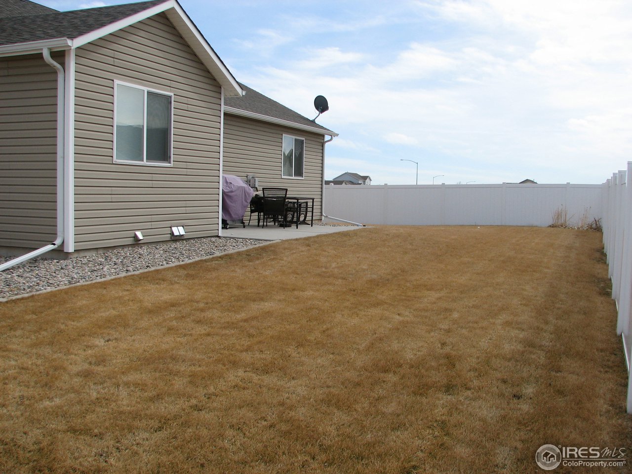 6887 McClellan Road Wellington, CO 80549 - Photo 23 of 25 The yard is fully fenced with a sprinkler system