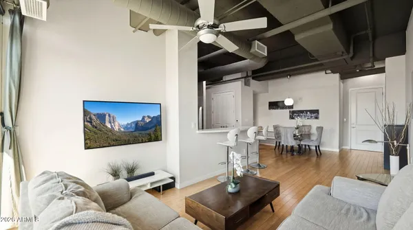 a view of a dining room with furniture and wooden floor