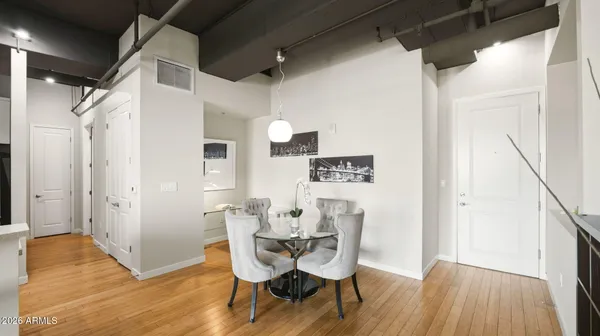 a bedroom with a bed a couch and a ceiling fan