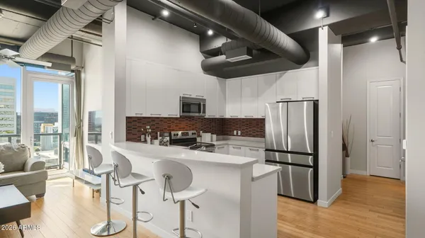 a kitchen with a sink and stove