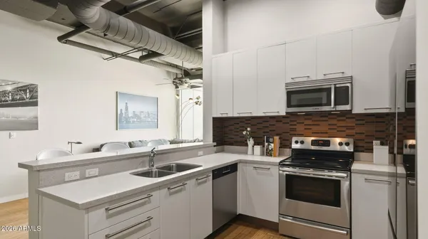 a kitchen with a stove and a microwave