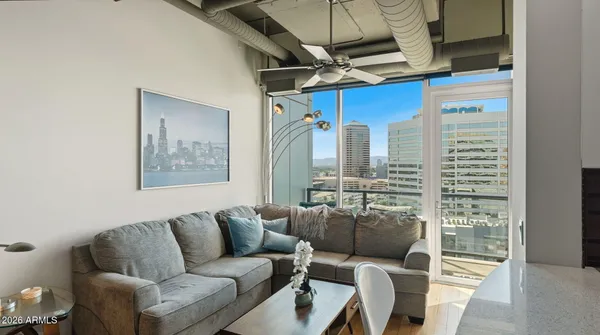 a living room with furniture and a window