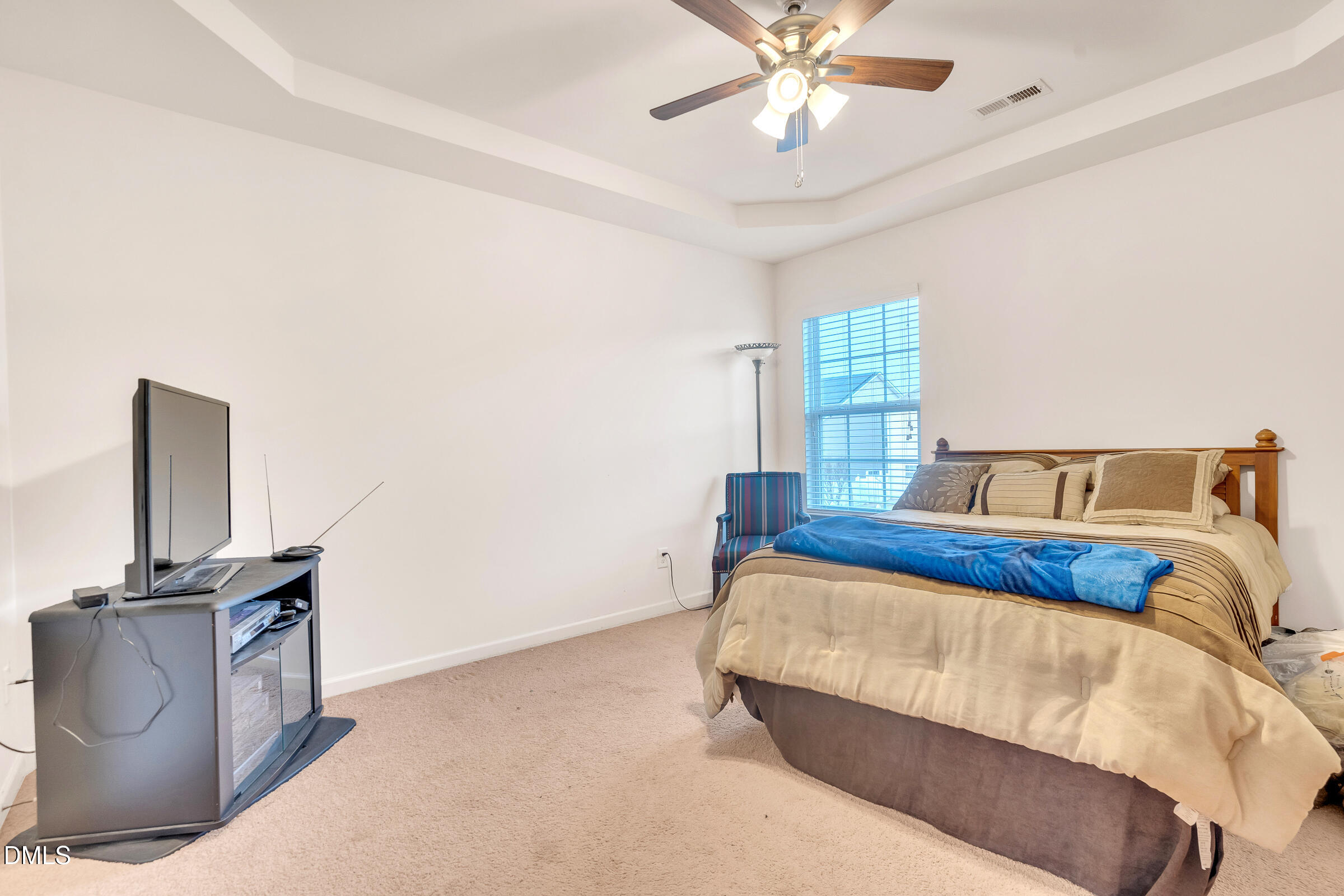 5165 Busted Rock Trail Raleigh, NC 27610 - Photo 17 of 18 a bedroom with a bed and dresser