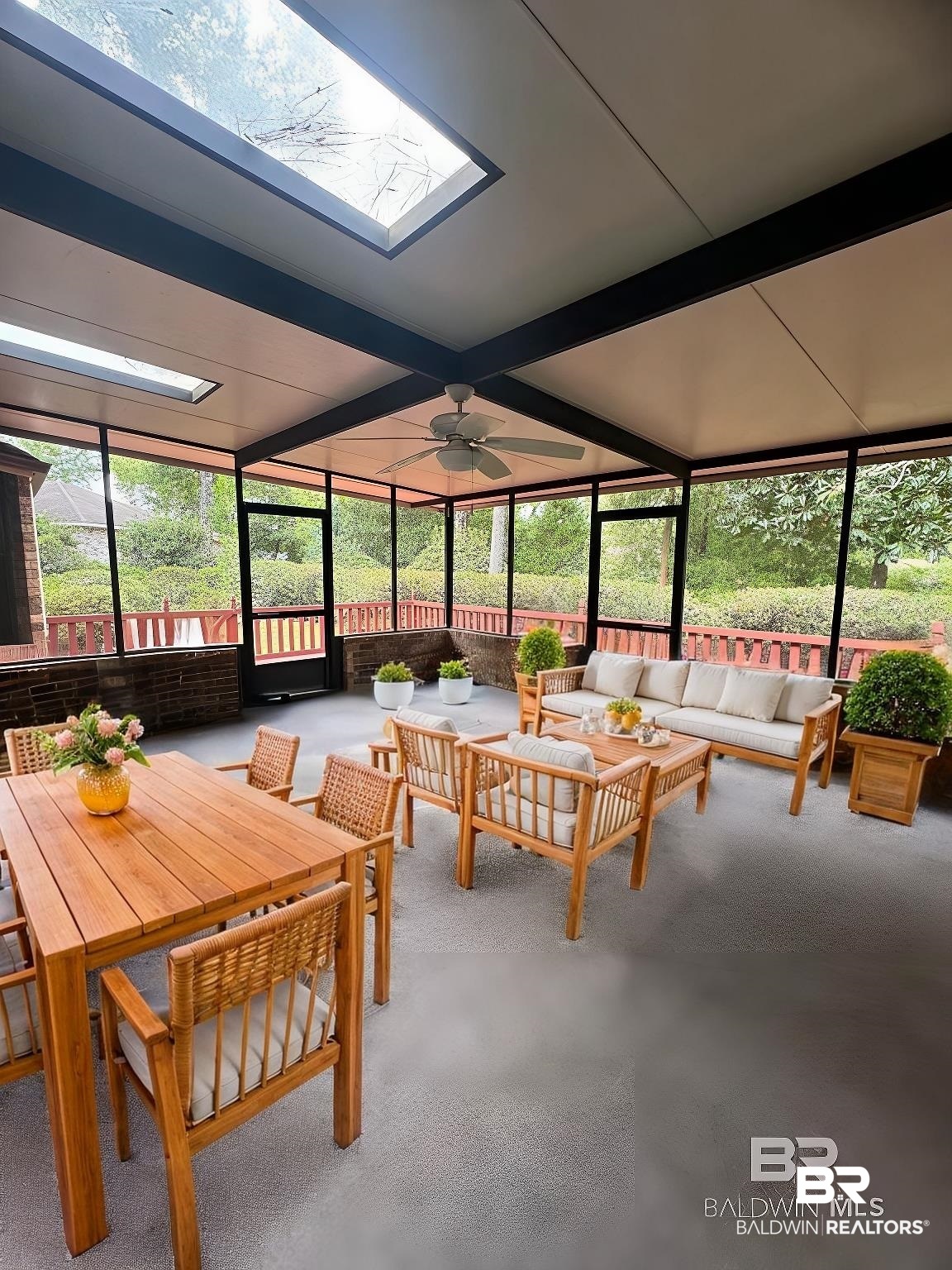 2240 Perdido Circle Lillian, AL 36549 - Photo 5 of 42 Sunroom with beam ceiling, a skylight, and ceiling fan