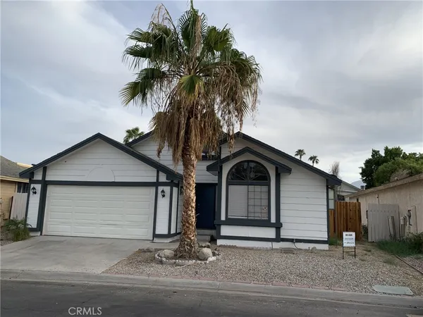 a front view of a house with a garage