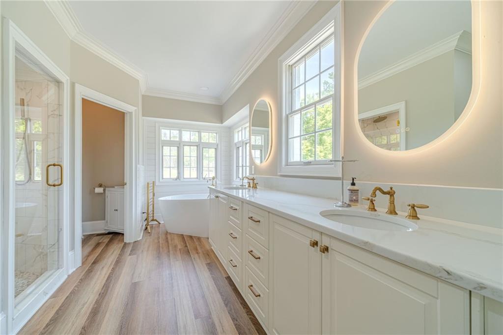 1271 Carl Davis Road Northwest Monroe, GA 30656 - Photo 27 of 80 a spacious bathroom with a double vanity sink a mirror and a shower