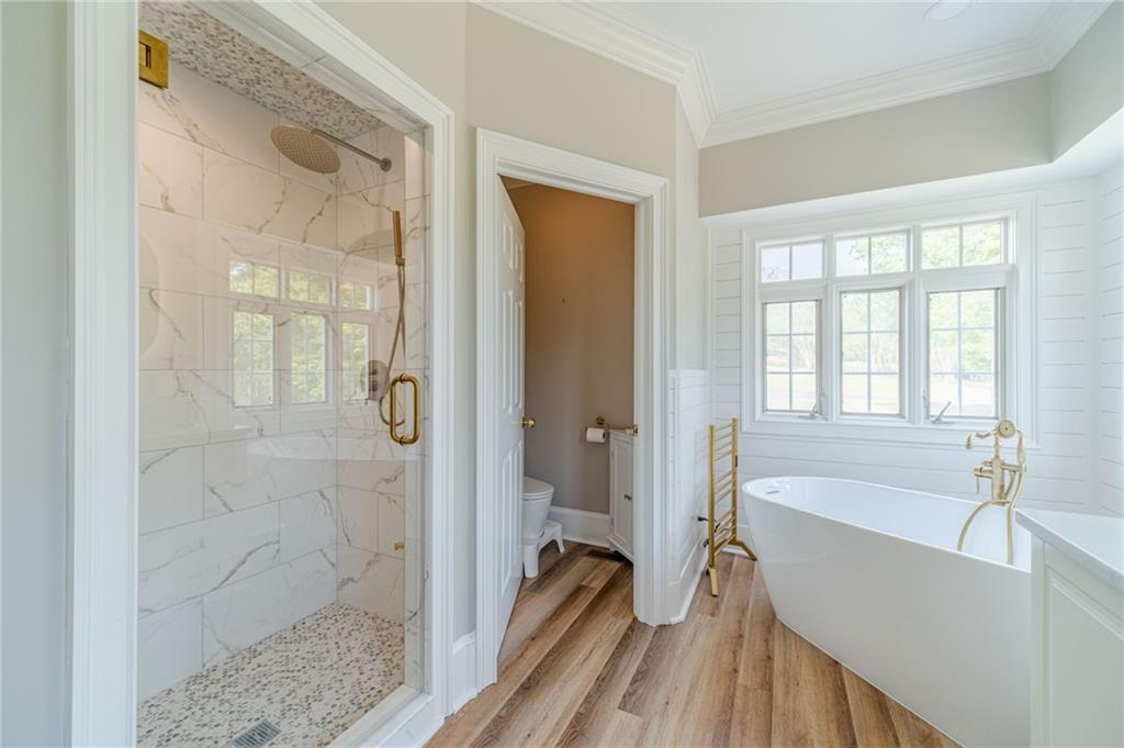 1271 Carl Davis Road Northwest Monroe, GA 30656 - Photo 28 of 80 a bathroom with a tub shower and sink