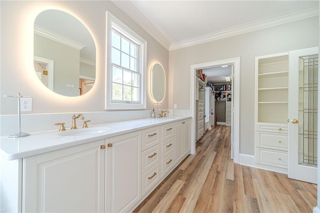 1271 Carl Davis Road Northwest Monroe, GA 30656 - Photo 31 of 80 a spacious bathroom with a double vanity sink a mirror and a shower