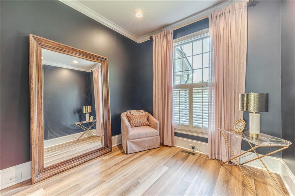 1271 Carl Davis Road Northwest Monroe, GA 30656 - Photo 32 of 80 a view of a room that has a bed and a view of bedroom with wooden floor