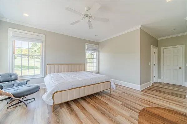 a bathroom with a granite countertop sink a toilet and a mirror