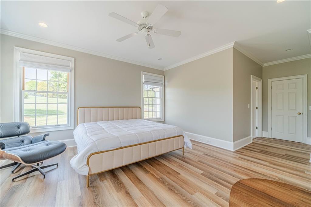 1271 Carl Davis Road Northwest Monroe, GA 30656 - Photo 38 of 80 a bedroom with a bed and wooden floor