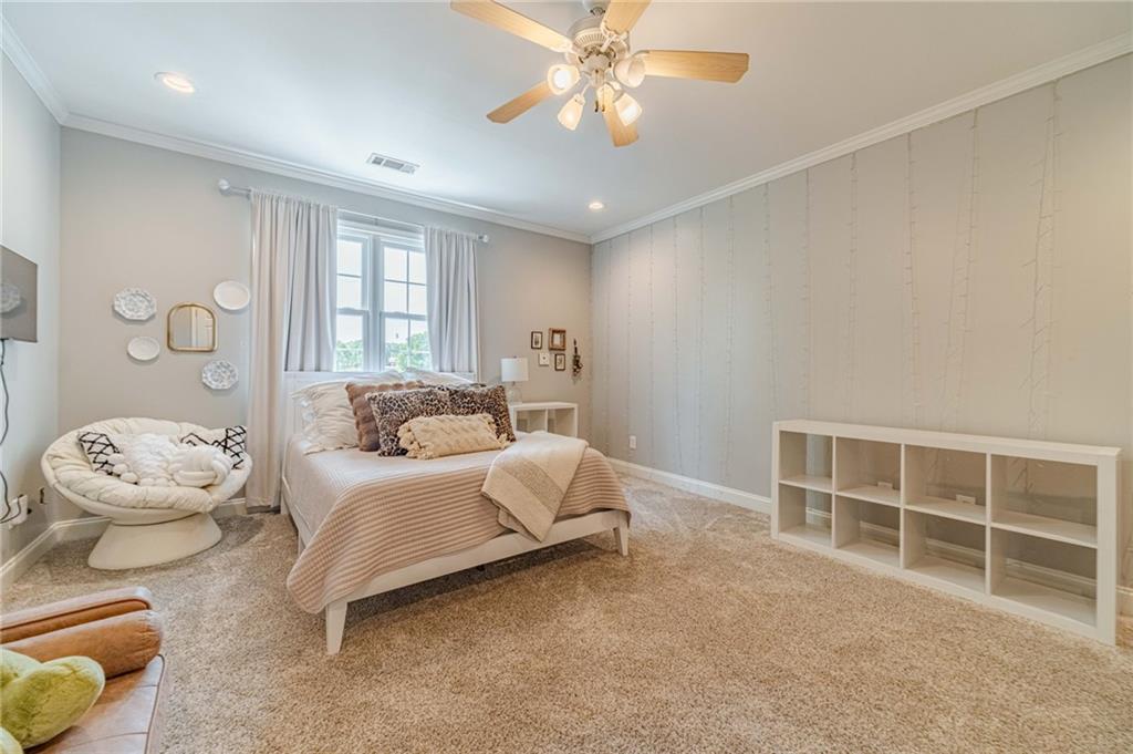 1271 Carl Davis Road Northwest Monroe, GA 30656 - Photo 44 of 80 a spacious bedroom with a bed and a window