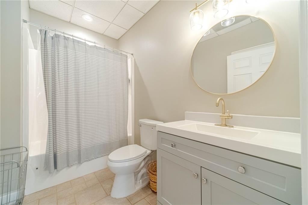 1271 Carl Davis Road Northwest Monroe, GA 30656 - Photo 64 of 80 a bathroom with a sink a toilet and a mirror