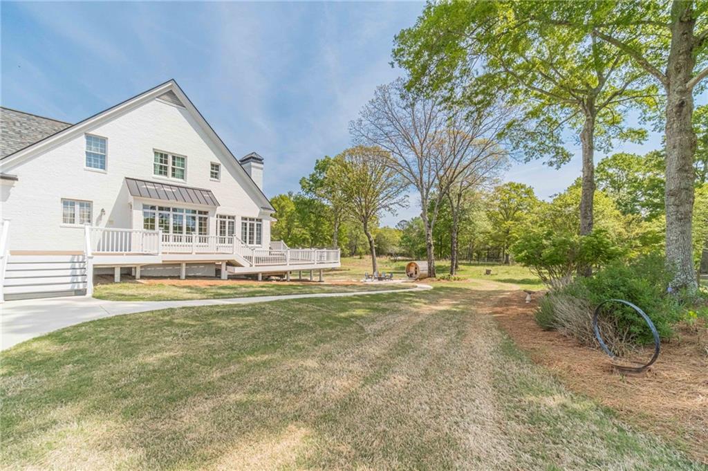 1271 Carl Davis Road Northwest Monroe, GA 30656 - Photo 72 of 80 a view of a house with a big yard and large trees