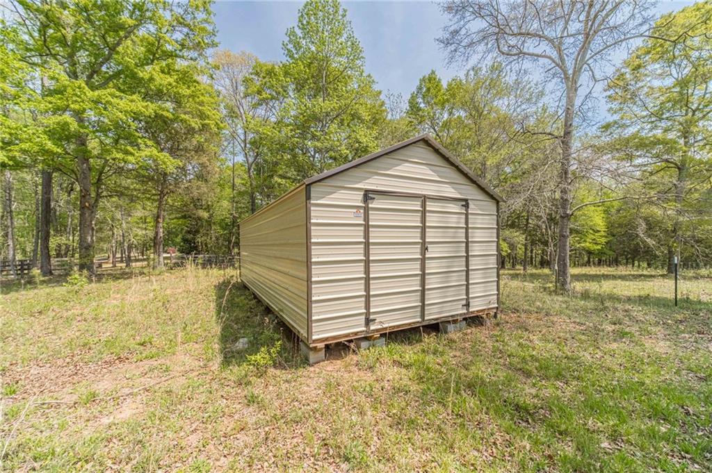 1271 Carl Davis Road Northwest Monroe, GA 30656 - Photo 76 of 80 a view of a house with a yard