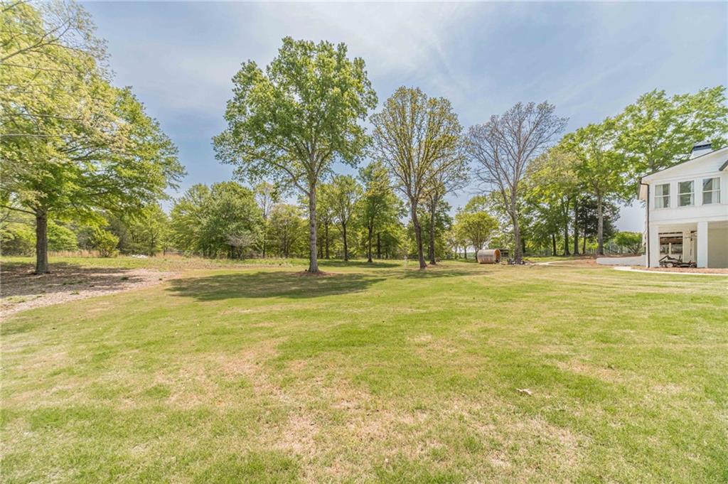 1271 Carl Davis Road Northwest Monroe, GA 30656 - Photo 77 of 80 a view of swimming pool with an outdoor space and seating area
